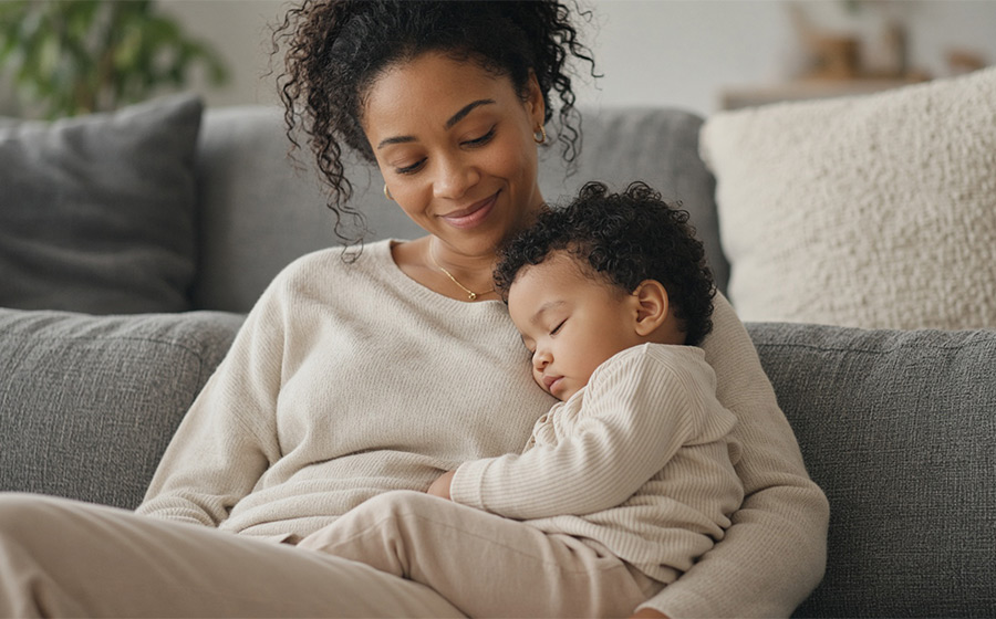 Mother and toddler on a couch, relaxed